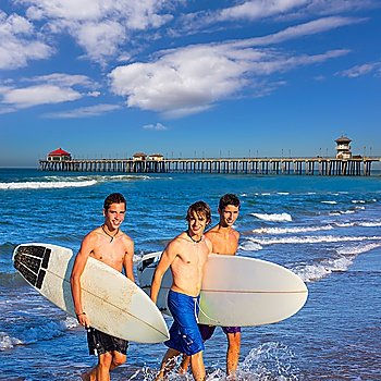 Boys surfers group coming out from Huntington beach California