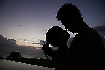 Silhouette of young couple at the beach