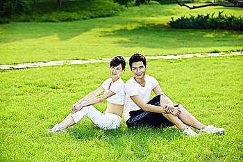 Couple sitting on the grass