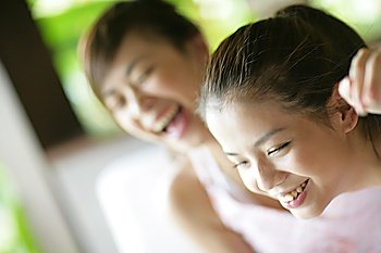 Two young women laughing