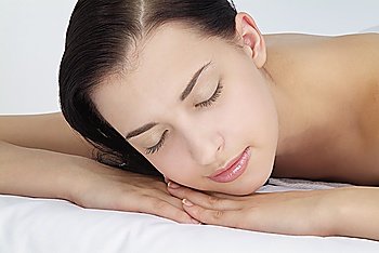 Close-up of young woman lying on front