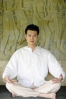 Young man practising yoga