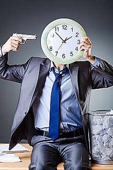 Man with clock and pile of papers