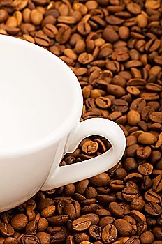 Cup and coffee beans isolated on the  white