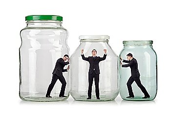 Young businessman in glass jar