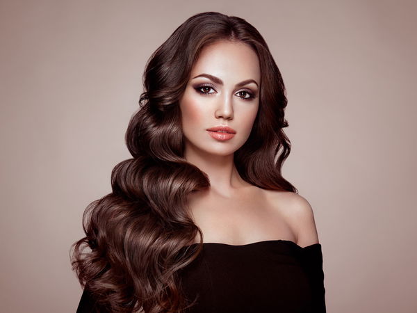 brunette girl with long healthy and shiny curly hair. care and beauty. beautiful model woman with wavy hairstyle. make up and black dress | Cheap Royalty Free Subscription, Stock Photos, Vector Illustrations brunette girl with long healthy and shiny curly hair. care and beauty. beautiful model woman with wavy hairstyle. make up and black dress | Cheap Royalty Free Subscription, Stock Photos, Vector Illustrations