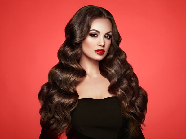 brunette girl with long healthy and shiny curly hair. care and beauty. beautiful model woman with wavy hairstyle. make up and black dress | Cheap Royalty Free Subscription, Stock Photos, Vector Illustrations brunette girl with long healthy and shiny curly hair. care and beauty. beautiful model woman with wavy hairstyle. make up and black dress | Cheap Royalty Free Subscription, Stock Photos, Vector Illustrations