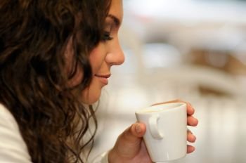 Portrait of beautiful elegant woman with coffee cup 