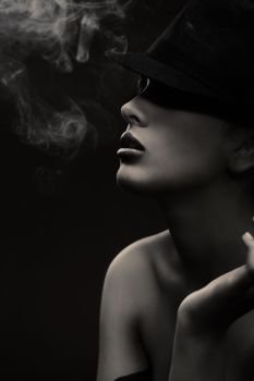 Smoking hot lady in a men’s hat