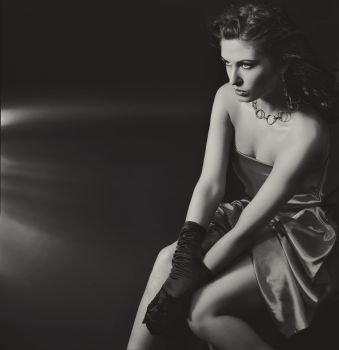 Black&white image of an elegant, serious woman