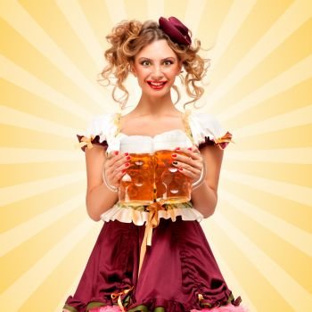 Beautiful sexy Oktoberfest waitress, wearing a traditional Bavarian dress dirndl, serving two big beer mugs in a tavern and smiling on colorful abstract cartoon style background.