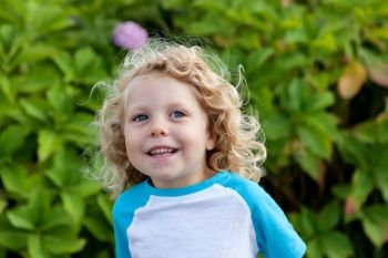 Beautiful boy four year old with long blond hair  