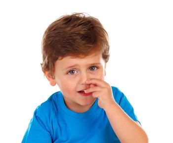 Funny child scratching his nose. Funny child scratching his nose isolated on a white background