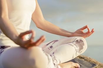 yoga woman meditating outdoors. yoga woman meditating outdoors, close-up hands