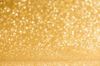 Shiny golden lights background. Shiny golden bokeh glitter lights abstract background, Christmas New Year party celebration concept