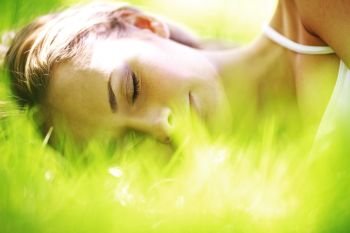 woman sleep on green grass. woman sleep on grass