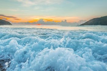 Raging waves at sunset. Close-up view of raging waves on beach at sunset, tropical landscape