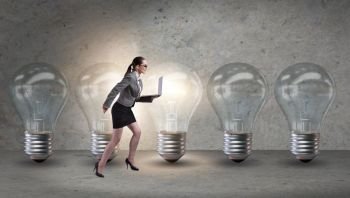 Businesswoman in new idea concept with light bulb