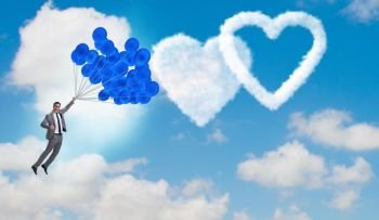 Man flying balloons in romantic concept