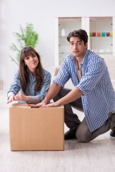 Young family moving in to new apartment after paying off mortgage
