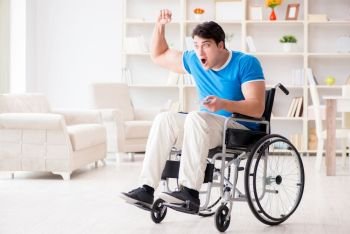 Disabled man watching sports on tv