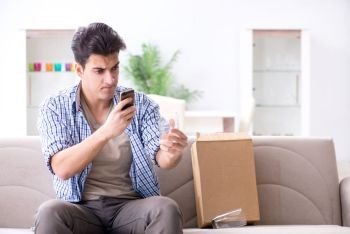 Man receiving wrong parcel with glasses