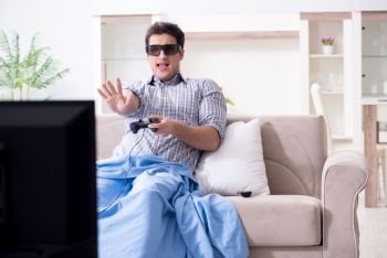 Man playing 3d games at home