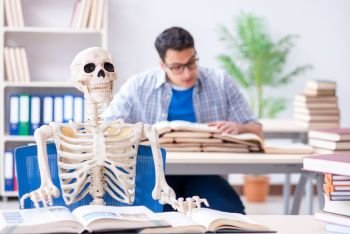 The student skeleton listening to lecture in classroom. Student skeleton listening to lecture in classroom