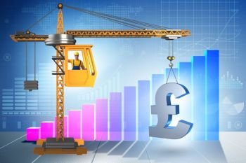 Construction crane lifting british pound in currency business co. Construction crane lifting british pound in currency business concept. Construction crane lifting british pound in currency business co