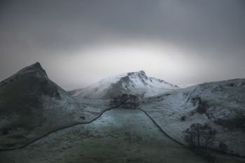 Beautiful Winter landscape image of Chrome Hill and Parkhouse Hill in Peak District England