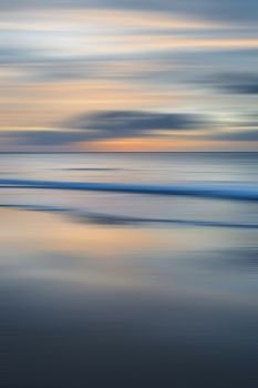 Stunning long exposure blur sunrise landsdcape of idyllic Broadhaven Bay beach on Pembrokeshire Coast in Wales