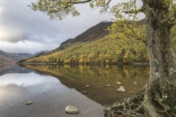 Stunning Autumn Fall landscape image of Lake Buttermere in Lake District England 