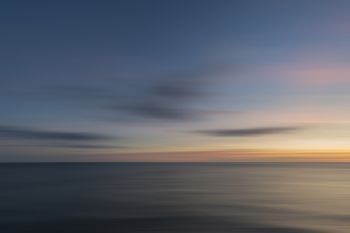 Beautiful long exposure landscape image of calm sea at St Govan’s Head on Pembrokeshire Coast in Wales