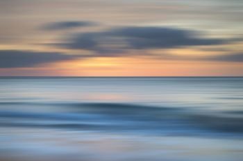 Stunning long exposure blur sunrise landsdcape of idyllic Broadhaven Bay beach on Pembrokeshire Coast in Wales