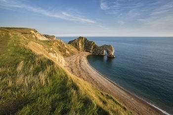 Seascapes. Landscape view of Durdle Door on the Jurassic Coast at sunset