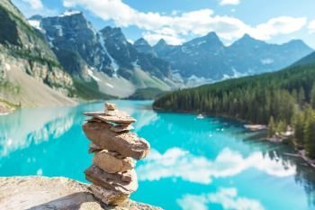 Moraine lake. Beautiful turquoise waters of the Moraine lake with snow-covered peaks above it in Banff National Park of Canada