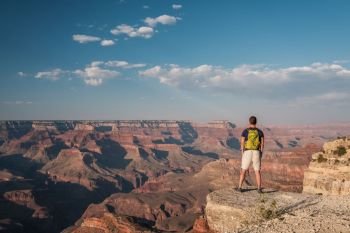 Tourist with backpack at Grand Canyon, Arizona, USA