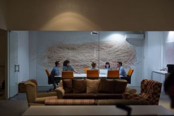 Business meeting in a modern office late in the evening