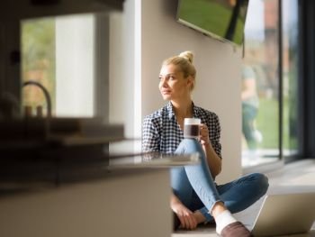 Real Woman Using laptop At Home on the floor Drinking Coffee Enjoying Relaxing