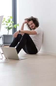 Real man Using laptop on the floor At Home  Enjoying Relaxing