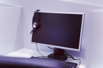 Computer and headset in empty call center office