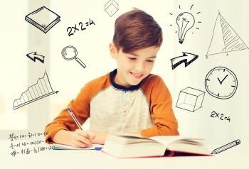 education, childhood, people, homework and school concept - smiling student boy with book writing to notebook at home over mathematical doodles. smiling student boy writing to notebook at home