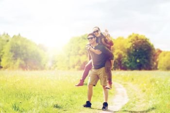 travel, hiking, backpacking, tourism and people concept - happy couple with backpacks having fun and walking along country road outdoors. happy couple with backpacks having fun outdoors