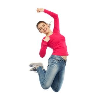 happiness, freedom, motion and people concept - smiling young woman jumping in air over white background. smiling young woman jumping in air