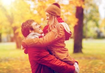 love, relationships, season and people concept - happy young couple meeting in autumn park. happy young couple meeting in autumn park