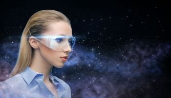 space, future technology and people concept - beautiful futuristic woman in virtual reality glasses over planet and stars background. woman in virtual reality glasses over space