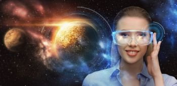space, future technology and people concept - beautiful futuristic woman in virtual reality glasses over planets and holograms background. woman in virtual reality glasses over space