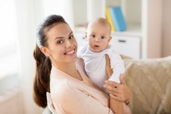family, motherhood and people concept - happy mother with little baby boy at home. happy mother with little baby boy at home
