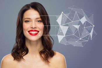 beauty, skin care and technology concept - happy smiling young woman over blue background with low poly hologram pointing to skin. beautiful woman with low poly hologram on skin