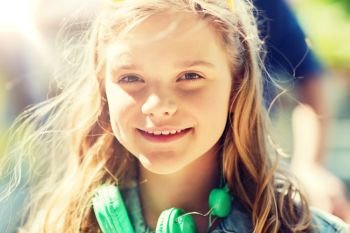 people, summer and portrait concept - happy teenage girl with headphones. happy teenage girl with headphones. happy teenage girl with headphones